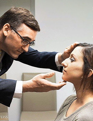 doctor sean weiss examining patient facial plastic surgery